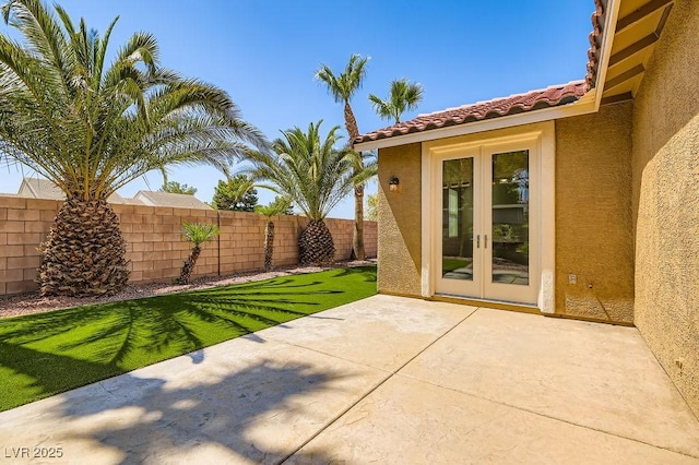 193 Lynbrook St, Henderson, NV 89012 - fenced backyard with french doors and a patio area