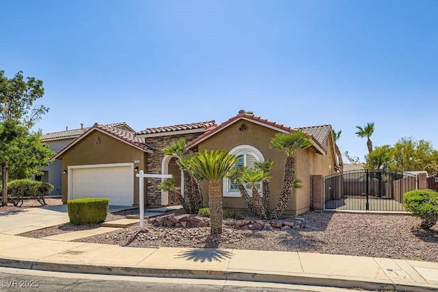 193 Lynbrook St, Henderson, NV 89012 - mediterranean / spanish-style house featuring driveway, stucco siding, a gate, a garage, and a tile roof