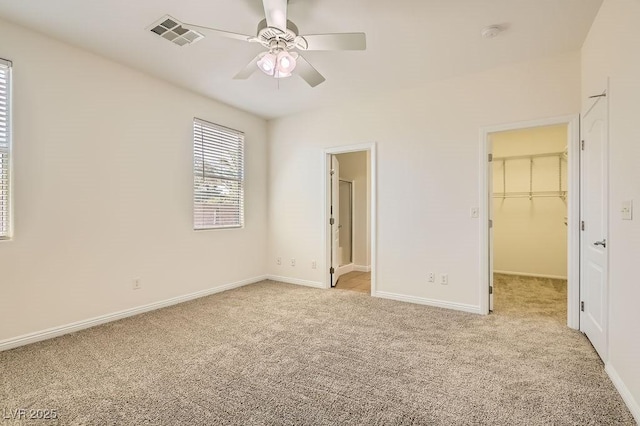 193 Lynbrook St, Henderson, NV 89012 - unfurnished bedroom with light colored carpet, a walk in closet, ensuite bathroom, and ceiling fan