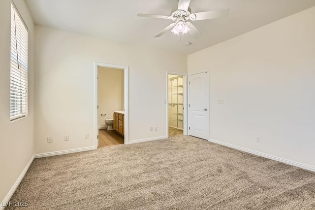 193 Lynbrook St, Henderson, NV 89012 - unfurnished bedroom with light colored carpet, multiple windows, ensuite bathroom, and ceiling fan