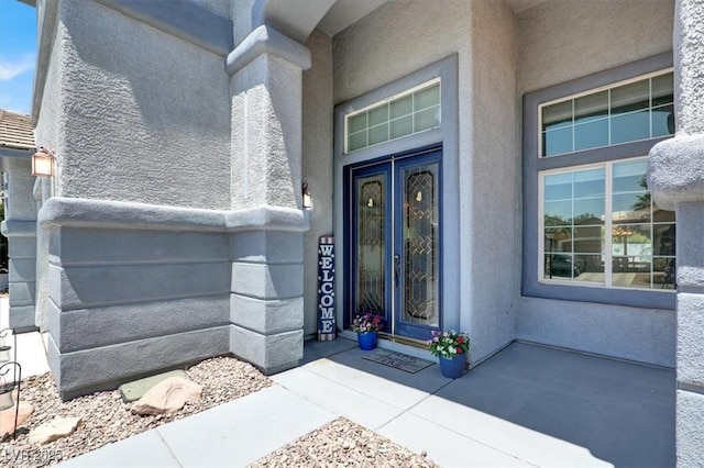 7816 Red Leaf Dr, Las Vegas, NV 89131 - doorway to property featuring french doors and stucco siding