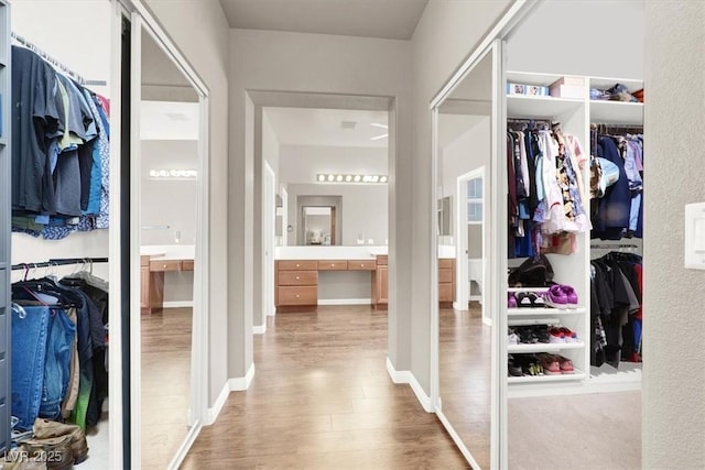 7816 Red Leaf Dr, Las Vegas, NV 89131 - walk in closet with wood finished floors