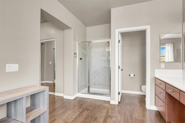 7816 Red Leaf Dr, Las Vegas, NV 89131 - bathroom with vanity, a stall shower, and wood finished floors