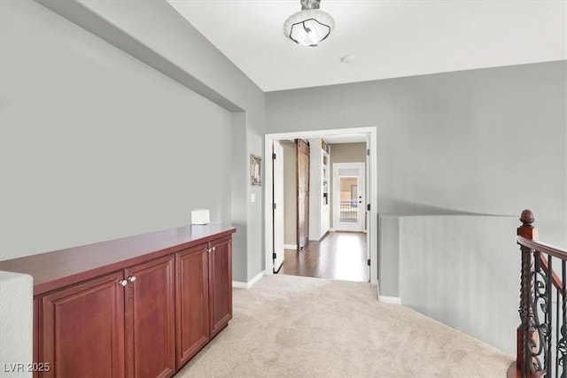 7816 Red Leaf Dr, Las Vegas, NV 89131 - corridor featuring an upstairs landing and light colored carpet