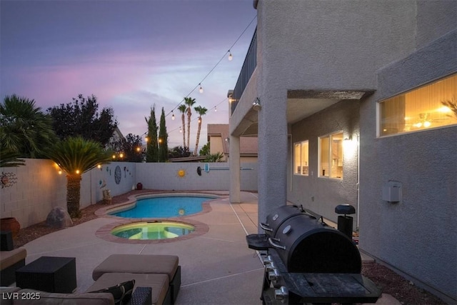 7816 Red Leaf Dr, Las Vegas, NV 89131 - pool at dusk featuring a patio, an in-ground hot tub, and a fenced backyard