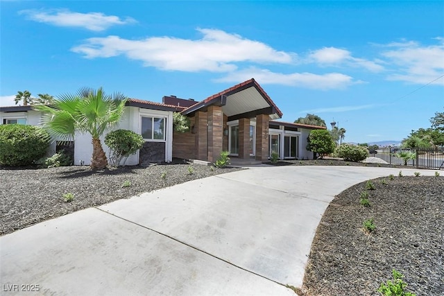1900 S 15th St, Las Vegas, NV 89104 - view of front of home with driveway, stucco siding, and a tile roof