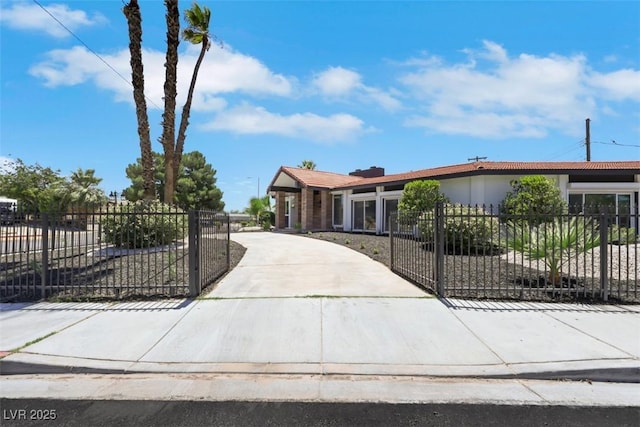 1900 S 15th St, Las Vegas, NV 89104 - single story home with a fenced front yard, a gate, stucco siding, and driveway