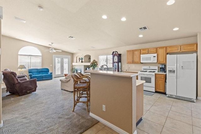 5208 Regena Rose St, North Las Vegas, NV 89081 - kitchen featuring white appliances, light countertops, ceiling fan, light tile patterned flooring, and recessed lighting