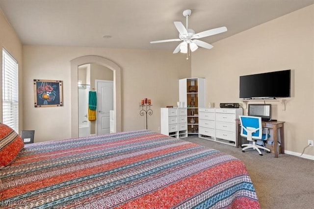 5208 Regena Rose St, North Las Vegas, NV 89081 - carpeted bedroom with arched walkways, a ceiling fan, and ensuite bath