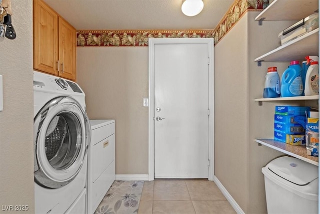 5208 Regena Rose St, North Las Vegas, NV 89081 - washroom with washing machine and clothes dryer, light tile patterned floors, and cabinet space