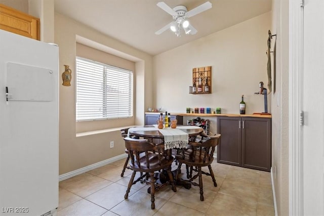 5208 Regena Rose St, North Las Vegas, NV 89081 - dining area featuring ceiling fan, light tile patterned flooring, and lofted ceiling