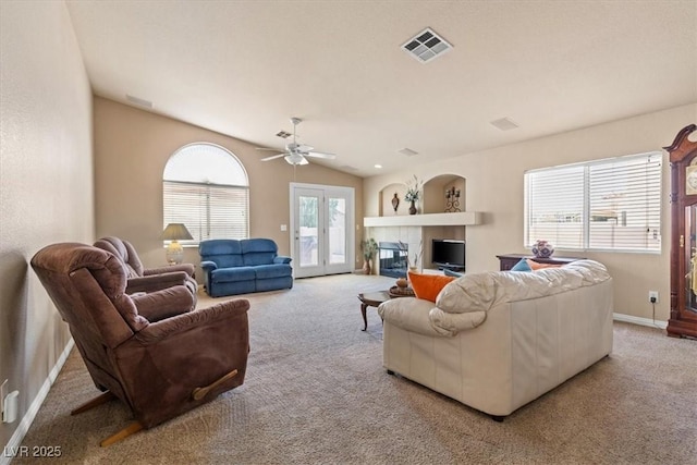 5208 Regena Rose St, North Las Vegas, NV 89081 - living room featuring carpet floors, ceiling fan, and a tiled fireplace