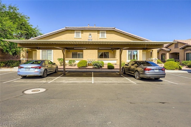 8805 Jeffreys St Unit 1089, Las Vegas, NV 89123 - view of front of property featuring covered parking and stucco siding