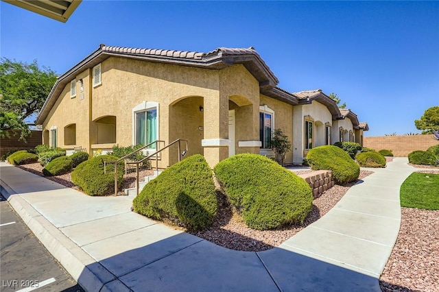 8805 Jeffreys St Unit 1089, Las Vegas, NV 89123 - view of side of home featuring stucco siding and a tile roof