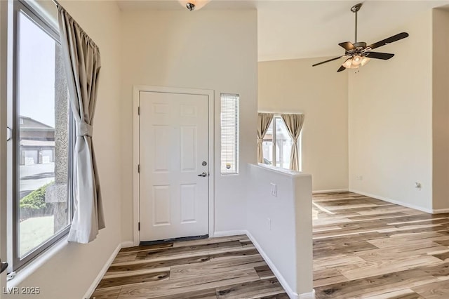 8805 Jeffreys St Unit 1089, Las Vegas, NV 89123 - foyer entrance with light wood-style floors, a ceiling fan, and a towering ceiling