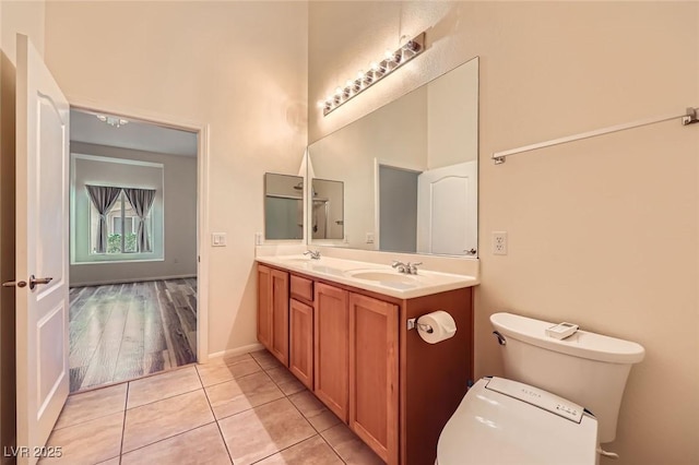 8805 Jeffreys St Unit 1089, Las Vegas, NV 89123 - bathroom with a towering ceiling, double vanity, and tile patterned flooring