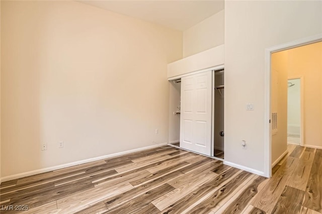 8805 Jeffreys St Unit 1089, Las Vegas, NV 89123 - unfurnished bedroom with wood finished floors and a closet