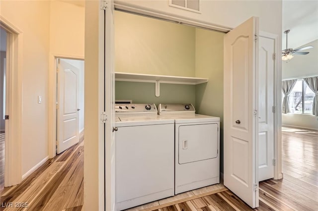 8805 Jeffreys St Unit 1089, Las Vegas, NV 89123 - washroom featuring washer and clothes dryer, light wood-style flooring, and ceiling fan