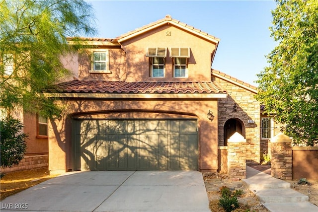 520 Ivy Spring St, Las Vegas, NV 89138 - mediterranean / spanish home featuring driveway, a garage, stucco siding, and a tiled roof