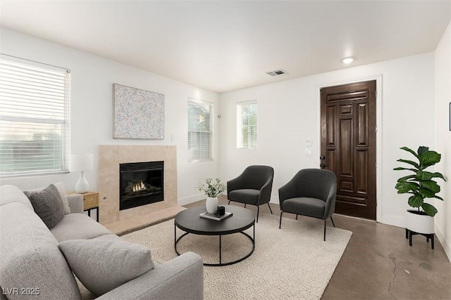520 Ivy Spring St, Las Vegas, NV 89138 - living room with concrete flooring and a high end fireplace