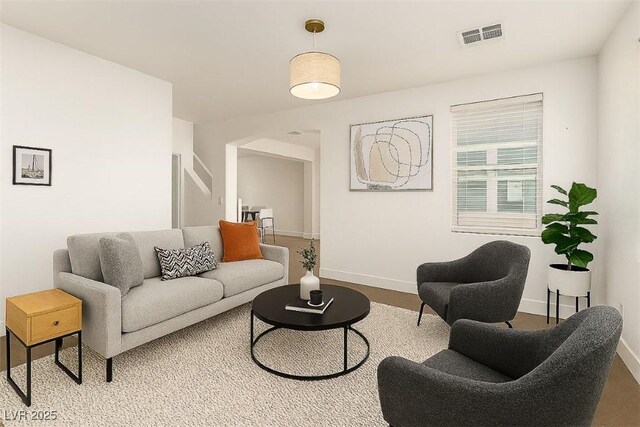 520 Ivy Spring St, Las Vegas, NV 89138 - living area featuring arched walkways and baseboards