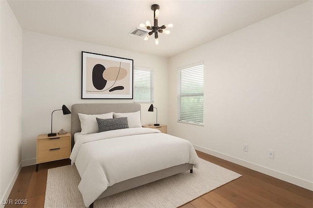 520 Ivy Spring St, Las Vegas, NV 89138 - bedroom featuring a chandelier and wood finished floors