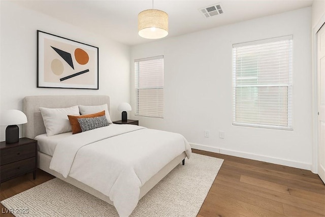 520 Ivy Spring St, Las Vegas, NV 89138 - bedroom featuring wood finished floors and multiple windows