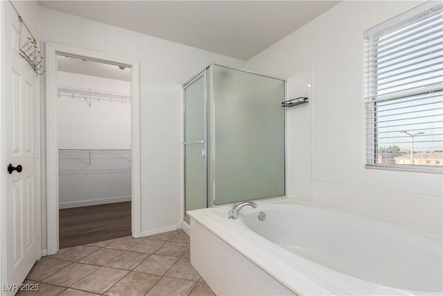 520 Ivy Spring St, Las Vegas, NV 89138 - full bath with a stall shower, a bath, a walk in closet, and tile patterned floors