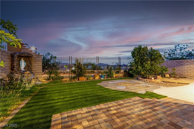520 Ivy Spring St, Las Vegas, NV 89138 - yard at dusk featuring a patio