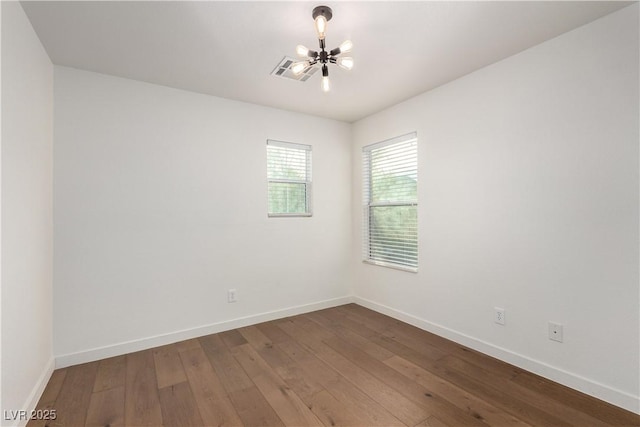 520 Ivy Spring St, Las Vegas, NV 89138 - unfurnished room featuring hardwood / wood-style flooring and a chandelier
