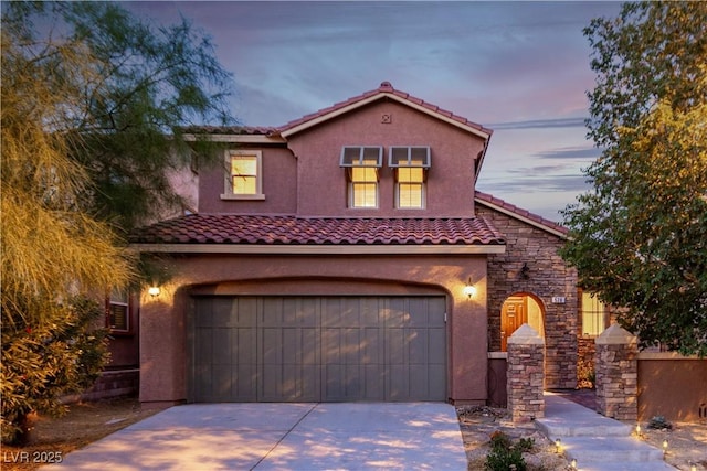 520 Ivy Spring St, Las Vegas, NV 89138 - mediterranean / spanish house with stucco siding, a tile roof, driveway, and an attached garage