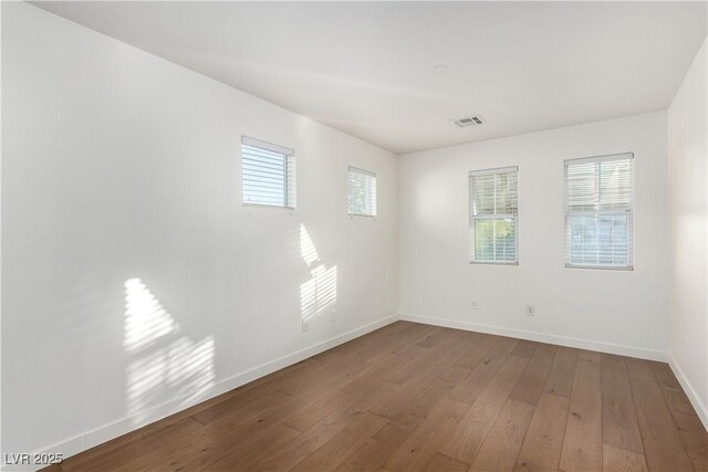 520 Ivy Spring St, Las Vegas, NV 89138 - unfurnished room with baseboards and hardwood / wood-style floors