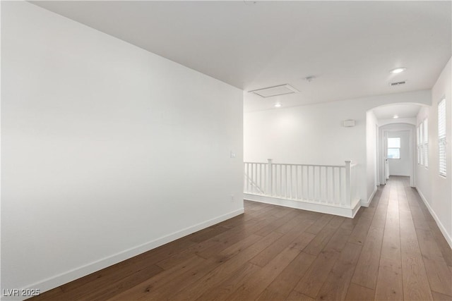 520 Ivy Spring St, Las Vegas, NV 89138 - unfurnished room featuring dark wood-style floors, arched walkways, and recessed lighting