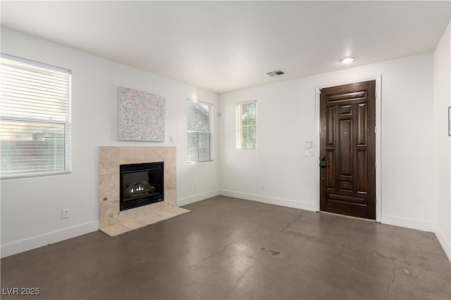 520 Ivy Spring St, Las Vegas, NV 89138 - unfurnished living room featuring finished concrete floors and a high end fireplace