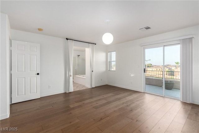 520 Ivy Spring St, Las Vegas, NV 89138 - spare room featuring wood finished floors and a smoke detector