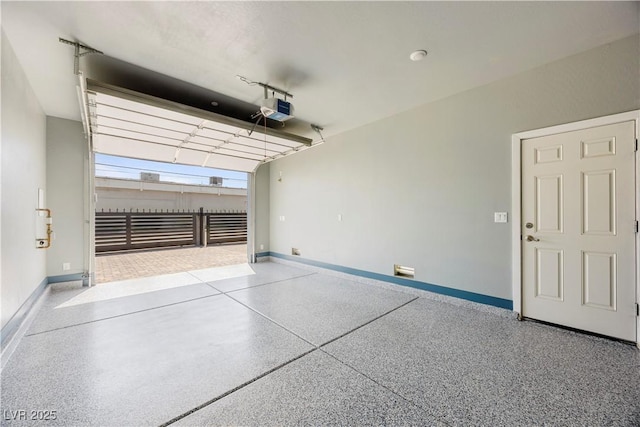 605 N Yale St, Las Vegas, NV 89107 - garage with a garage door opener and baseboards