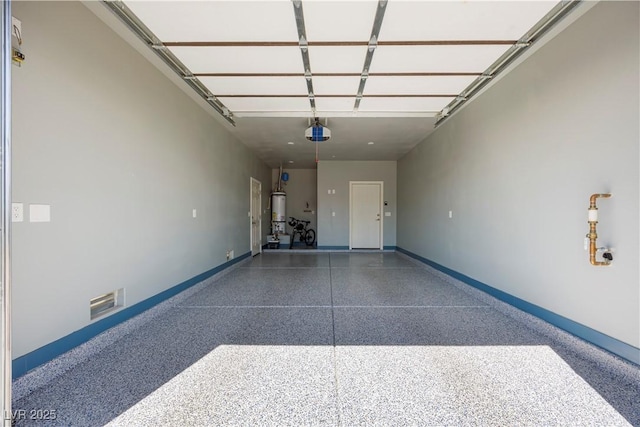 605 N Yale St, Las Vegas, NV 89107 - garage featuring a garage door opener and strapped water heater