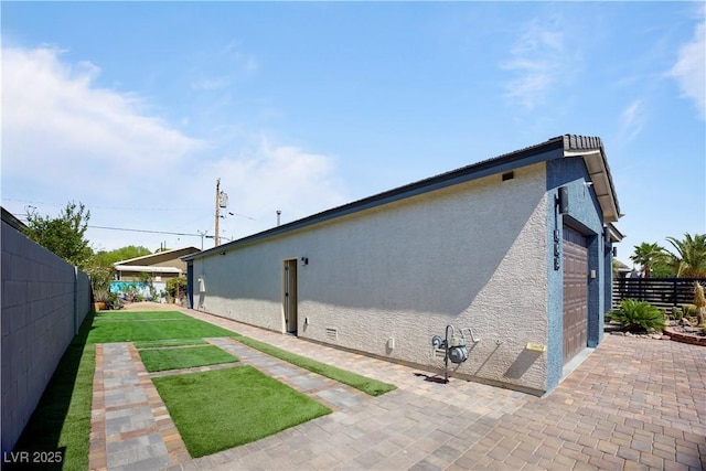 605 N Yale St, Las Vegas, NV 89107 - back of property featuring stucco siding