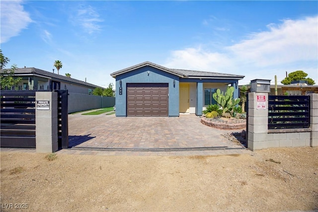605 N Yale St, Las Vegas, NV 89107 - ranch-style home featuring driveway, an attached garage, and stucco siding