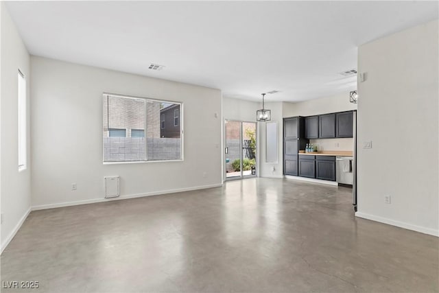 9420 Plover Falls Ave, Las Vegas, NV 89149 - unfurnished living room featuring a chandelier and finished concrete flooring