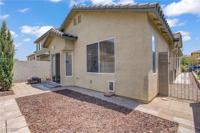 9420 Plover Falls Ave, Las Vegas, NV 89149 - back of house featuring stucco siding, a patio, and a tiled roof