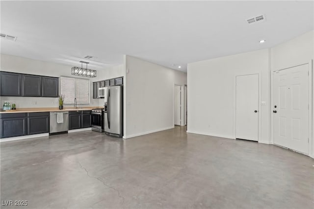 9420 Plover Falls Ave, Las Vegas, NV 89149 - unfurnished living room featuring concrete floors and recessed lighting