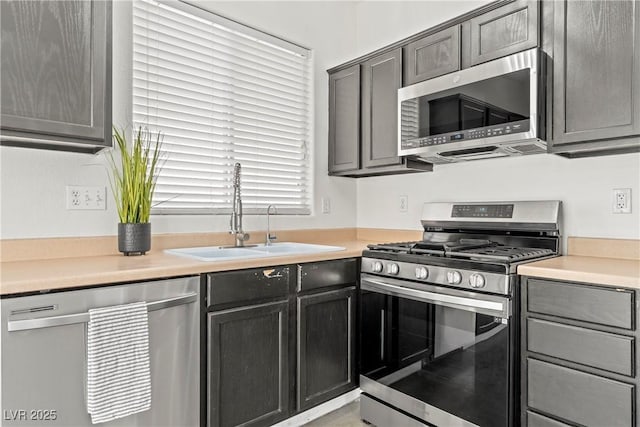 9420 Plover Falls Ave, Las Vegas, NV 89149 - kitchen featuring stainless steel appliances, light countertops, and gray cabinets