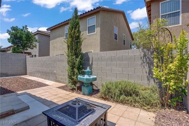 9420 Plover Falls Ave, Las Vegas, NV 89149 - view of patio featuring a fire pit