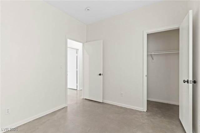 9420 Plover Falls Ave, Las Vegas, NV 89149 - unfurnished bedroom featuring concrete floors and baseboards