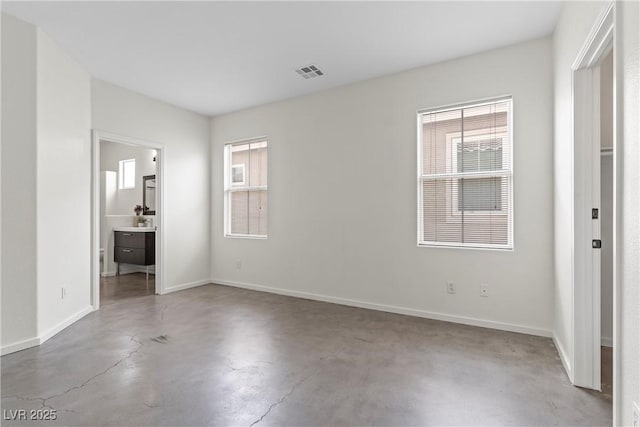 9420 Plover Falls Ave, Las Vegas, NV 89149 - unfurnished bedroom featuring finished concrete flooring and ensuite bath