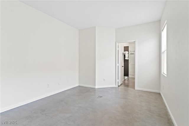 9420 Plover Falls Ave, Las Vegas, NV 89149 - spare room featuring finished concrete floors and plenty of natural light