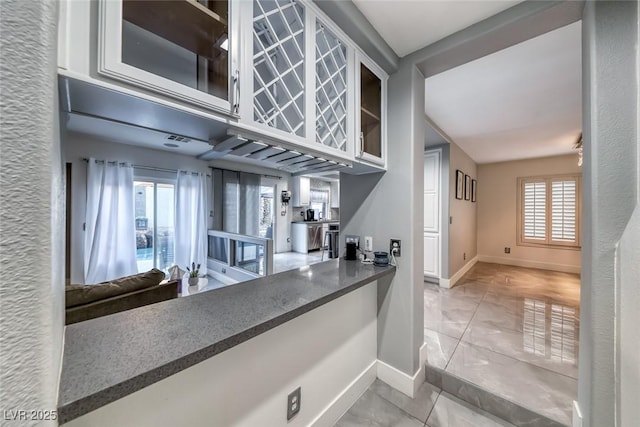 895 Beartooth Falls Ct, Henderson, NV 89052 - kitchen with glass insert cabinets and marble finish flooring