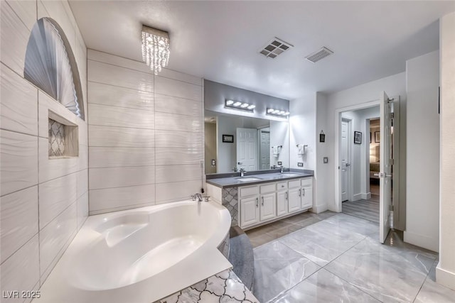 895 Beartooth Falls Ct, Henderson, NV 89052 - full bath featuring double vanity, a garden tub, and marble finish flooring