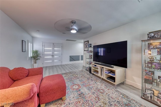 895 Beartooth Falls Ct, Henderson, NV 89052 - living area featuring wood finished floors and a ceiling fan